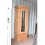 Late 19th/early 20th Century stripped pine wardrobe fitted one mirror door with drawer below