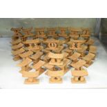 Large collection of miniature carved African stool/neck rests, each having the design name to the