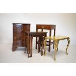 Nest of three occasional tables, serpentine front chest, a bedside table and an onyx top brass table