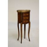 Reproduction Continental marquetry inlaid oval chest of three drawers raised on slender cabriole