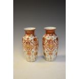 Pair of Japanese pottery vases decorated with iron-red and gilt foliate decoration, 19cm high