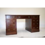 Old reproduction mahogany twin pedestal desk, with gilt-tooled red leather skiver, with three