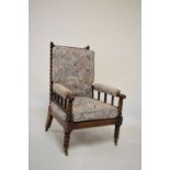 Late 19th Century 'Turners' chair with bobbin-turned back and arms, loose back and seat cushions,