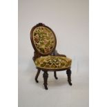 Late Victorian carved walnut occasional or nursing chair, 86cm high