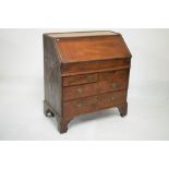 Mid 18th Century oak bureau fitted drawers and pigeon holes over retractable well, the front of