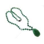 Chinese dyed jade pendant of pierced oval form with vase decoration, 47mm high, together with a