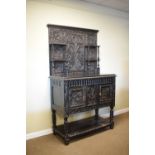 Heavily carved dark oak antique dresser, 107cm wide