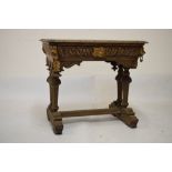 Late 19th/early 20th Century carved oak Flemish style side table fitted one frieze drawer, 82cm wide