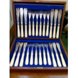 Cased set of fish eaters and one other of fruit knives and forks