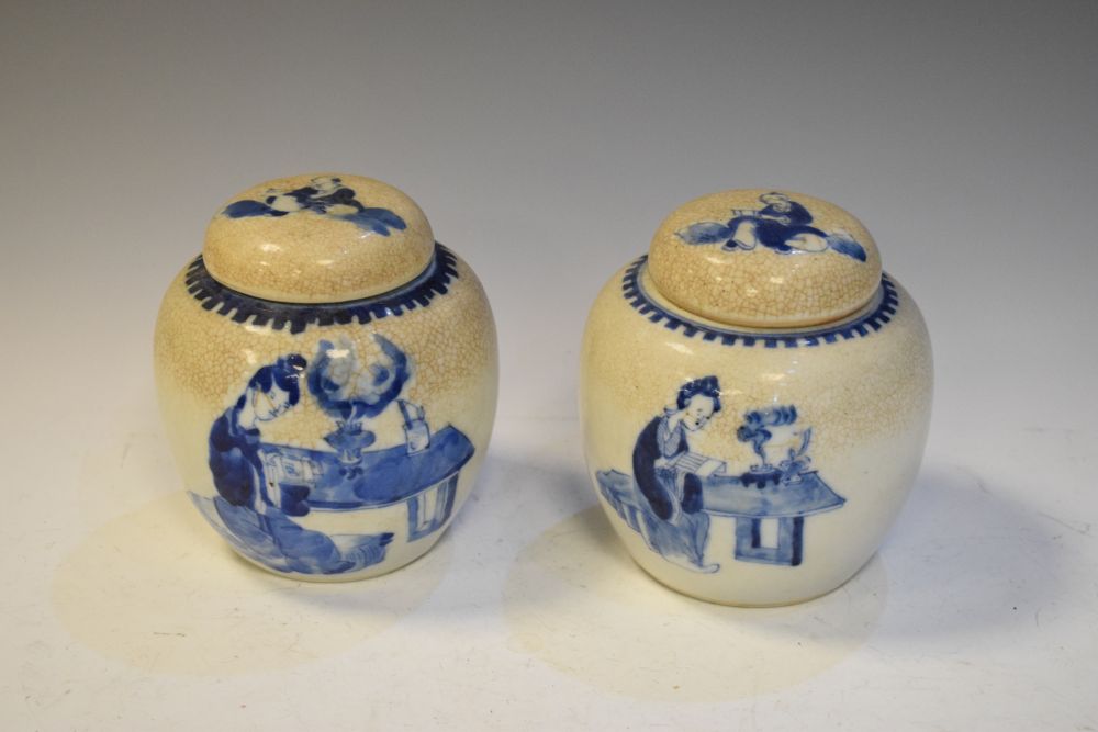 Pair of blue and white hand painted ginger jars and covers having four character mark to base,