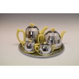 Retro ceramic tea service with chromed metal insulation covers, stamped beneath 877448, together