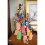 Group of polychrome decorated resin figures of Africans, the largest 64cm high