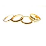 Three 22ct gold wedding bands, total 25g approx, together with a 9ct gold wedding band, 1.6g