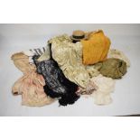 Two leather containers and a selection of textiles, costume and accessories to include; straw