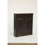 Heavily carved oak two door cabinet fitted three shelves, 94.5cm wide