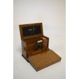 Early 20th Century oak fall-front stationery box enclosing blotter, stationery compartments,