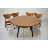 G-Plan circular dining table on ebonised supports, 120cm diameter, together with four G-Plan