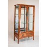 20th Century Chinese display cabinet with bevelled glazed doors enclosing two shelves, 92cm wide x