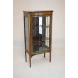 Early 20th Century mahogany-stained bowfront display cabinet with stained glass panels, 124cm high