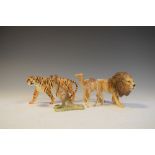 Four Beswick animal figures comprising Camel - Foal 1043, Lion - facing right 1506, Tigress - 1486