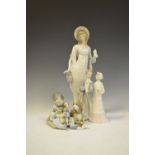 Three Lladro porcelain figure groups comprising: Bride & Groom, Child with dogs, and Lady, tallest
