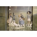 Four Lladro porcelain figure groups to include Girl at a water pump, Girl chasing ducks, etc,