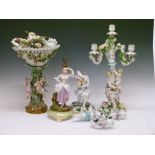 Pair of Continental porcelain figural candelabra, 51cm high (one to rebuild), plus a figural