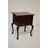 Early 20th Century mahogany-stained side cabinet with concave top on cabriole supports, 69cm wide