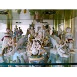 Assorted Continental porcelain figures to include a boy and girl with dog and cat, pair of figural