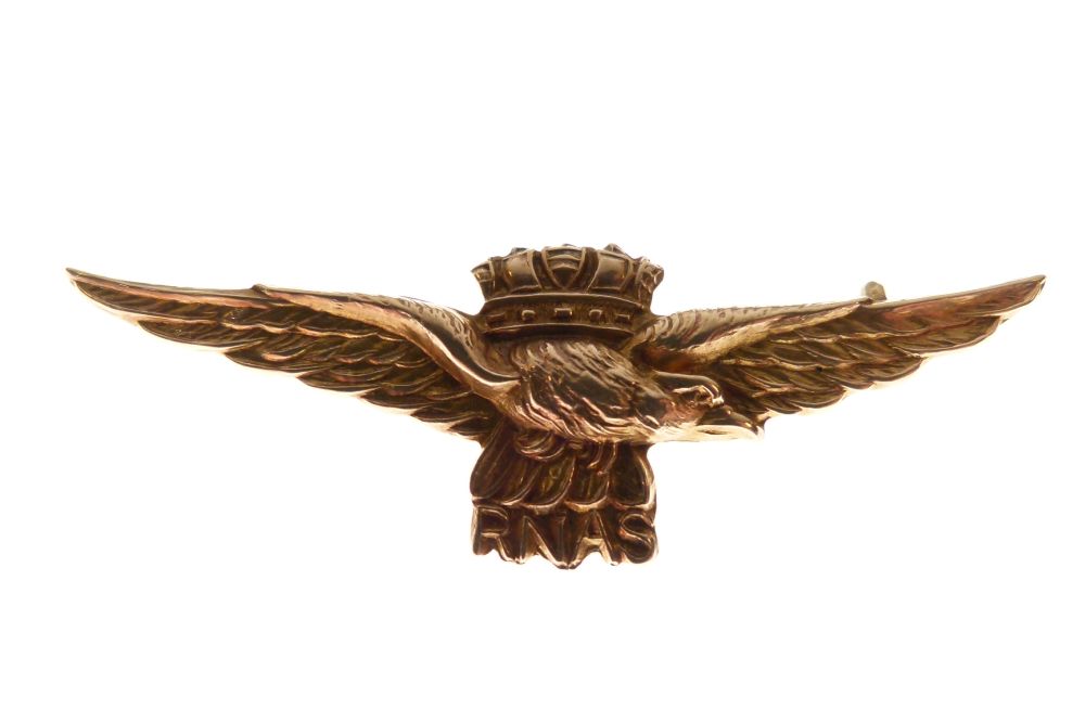 Yellow metal bar brooch with crowned eagle motif and initials RNAS for Royal Naval Air Station,