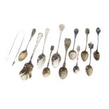 Assorted silver and white metal souvenir spoons, tongs, etc to include; a few enamel-mounted
