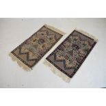 Small pair of Middle Eastern silk rugs, each 52cm x 92cm (2)