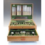 Harrod's Ltd (Retailers) - George V oak-cased part canteen of silver and other cutlery comprising: