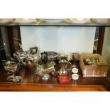 Assorted silver-plated wares to include three-piece tea pot, helmet sugar basin, flatware etc