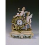 Continental porcelain mantel clock c.1900, modelled with cherubs and wheelbarrow, 29cm high