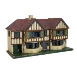 Large mock Tudor country house-style wooden dolls house, together with an assortment of furniture,