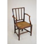 19th Century ash Provincial elbow chair having seagrass drop-in seat, raised on square supports