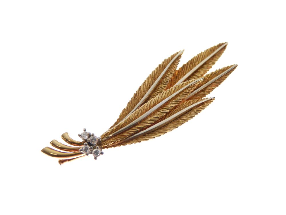 Yellow metal brooch of foliate or feather design set four small diamonds, stamped 750, 6cm wide,