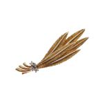 Yellow metal brooch of foliate or feather design set four small diamonds, stamped 750, 6cm wide,