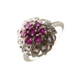 White metal, diamond and ruby cluster ring of flowerhead design, shank stamped K18, size N, 3.4g