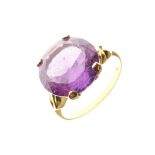 Yellow metal and purple stone dress ring, shank stamped 18k, size T, 5.1g gross approx