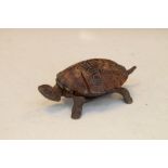 Cast metal and tortoiseshell table bell in the form of a tortoise, 14cm long