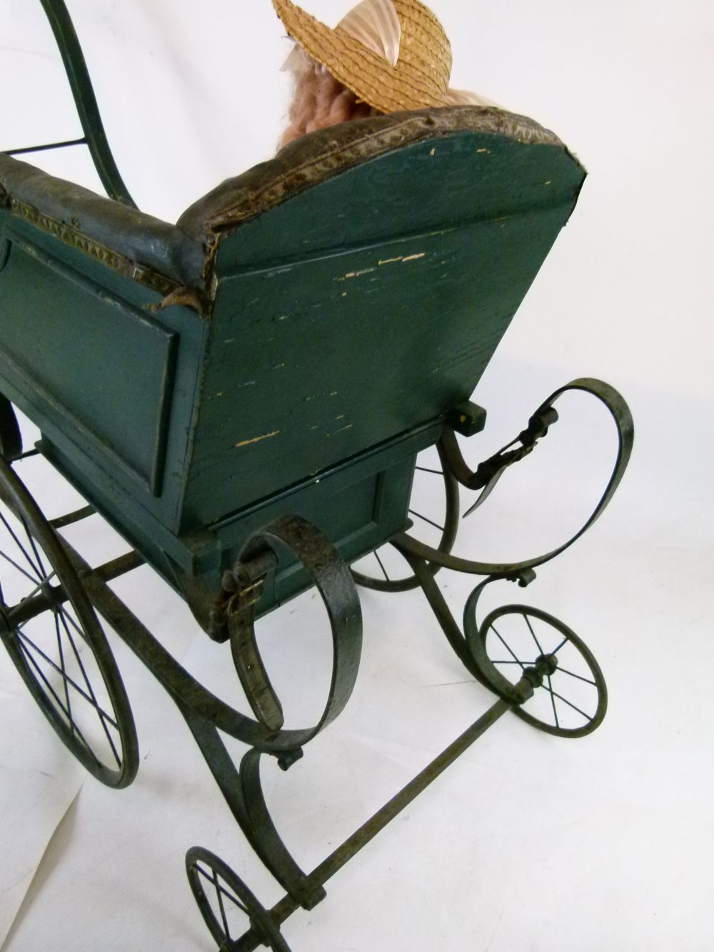 Late Victorian green painted wooden and iron perambulator (pram), with deep-buttoned hide seat- - Image 5 of 8