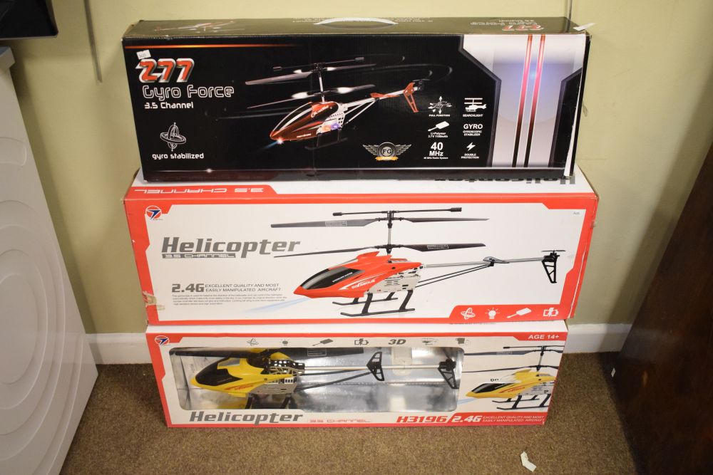 Two Wowitoys 3.5 channel H31962.4G remote control helicopters, together with 277 Gyroforce remote