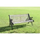 Black-painted metal garden bench with slatted seat, 155cm wide