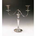 Elizabeth II silver two-branch table candelabrum with serpentine cartouche-shaped nozzles, drop-