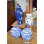 Two Oriental porcelain baluster jars and covers and a pair of ginger jars and covers