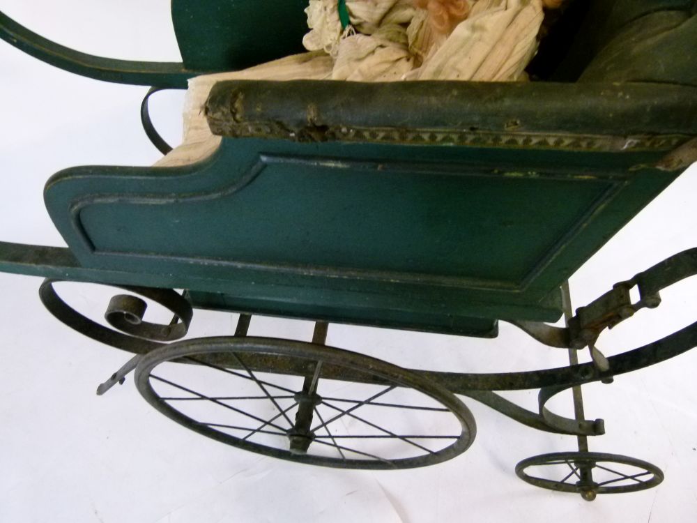 Late Victorian green painted wooden and iron perambulator (pram), with deep-buttoned hide seat- - Image 6 of 8
