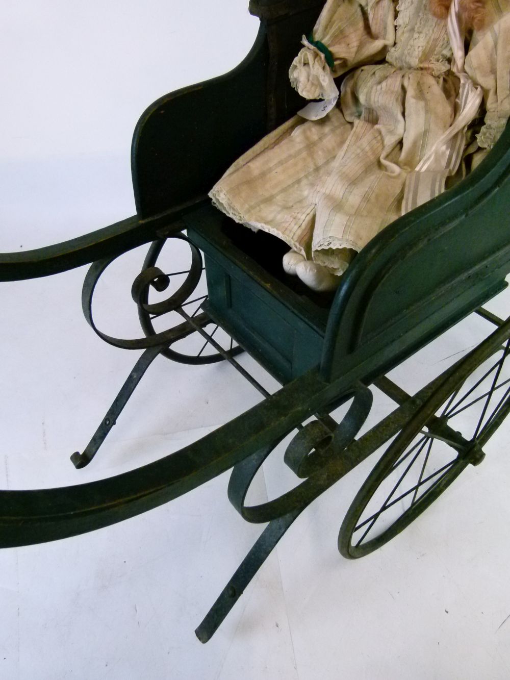 Late Victorian green painted wooden and iron perambulator (pram), with deep-buttoned hide seat- - Image 4 of 8