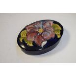 Moorcroft 'Hibiscus' pattern oval lidded pot, 12cm wide